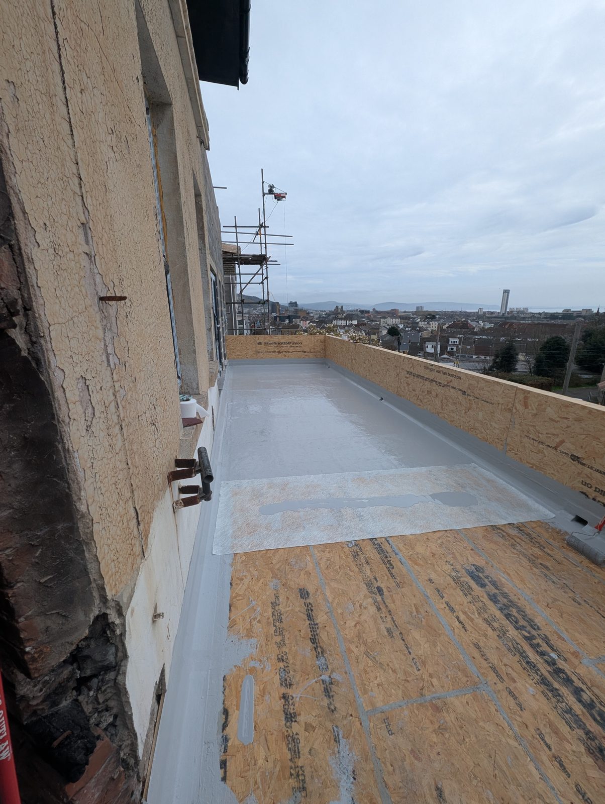 Waterproofed flat roof with views across Swansea to the bay